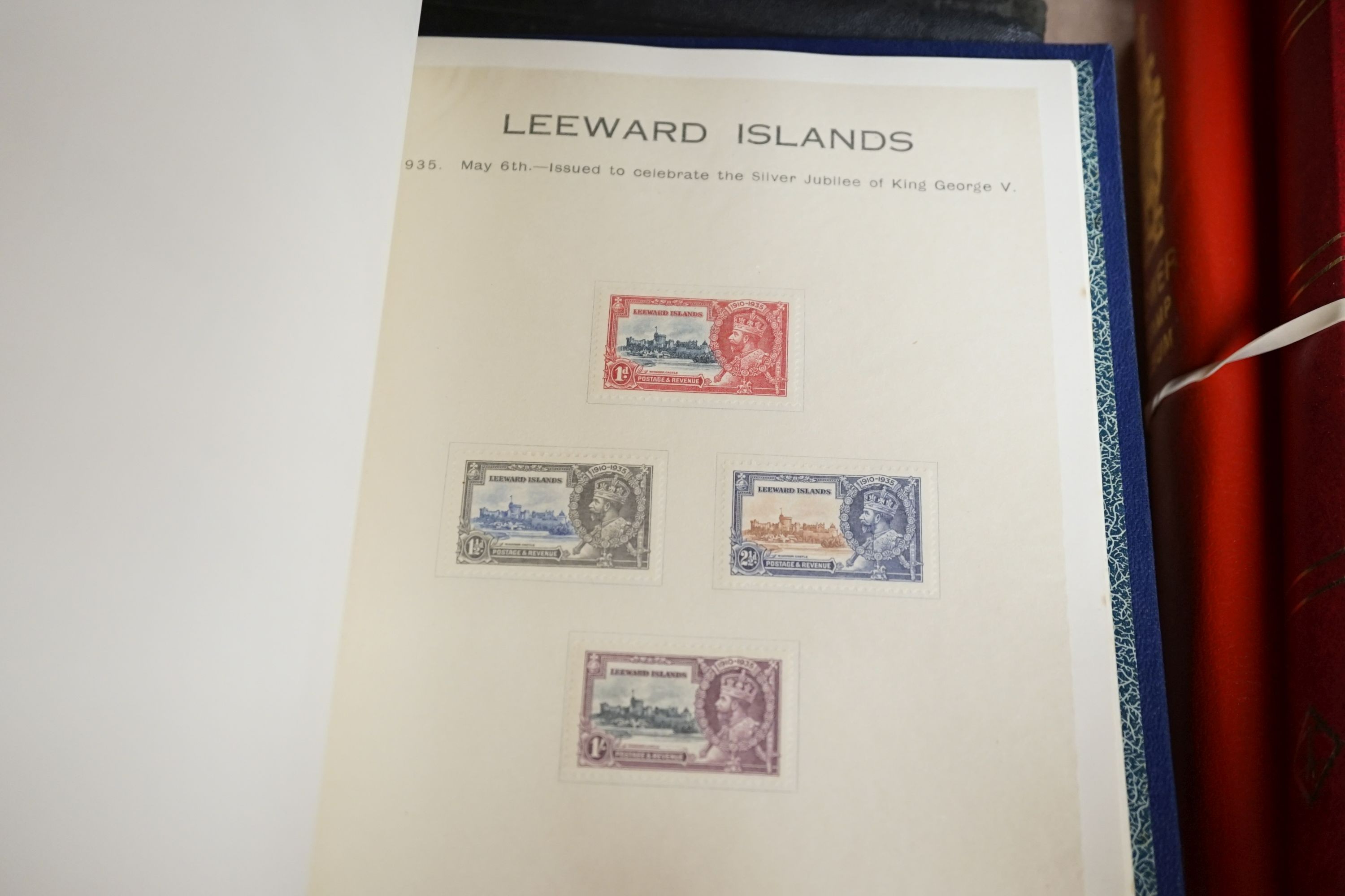 Three stamp albums with 1935 Silver Jubilee mint set of 250 including Egypt, 1937 Coronation two mint sets plus some used
